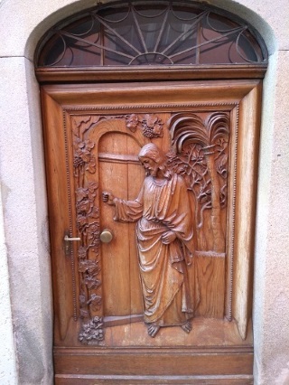 Carving of Jesus knocking on door in Passau, Germany